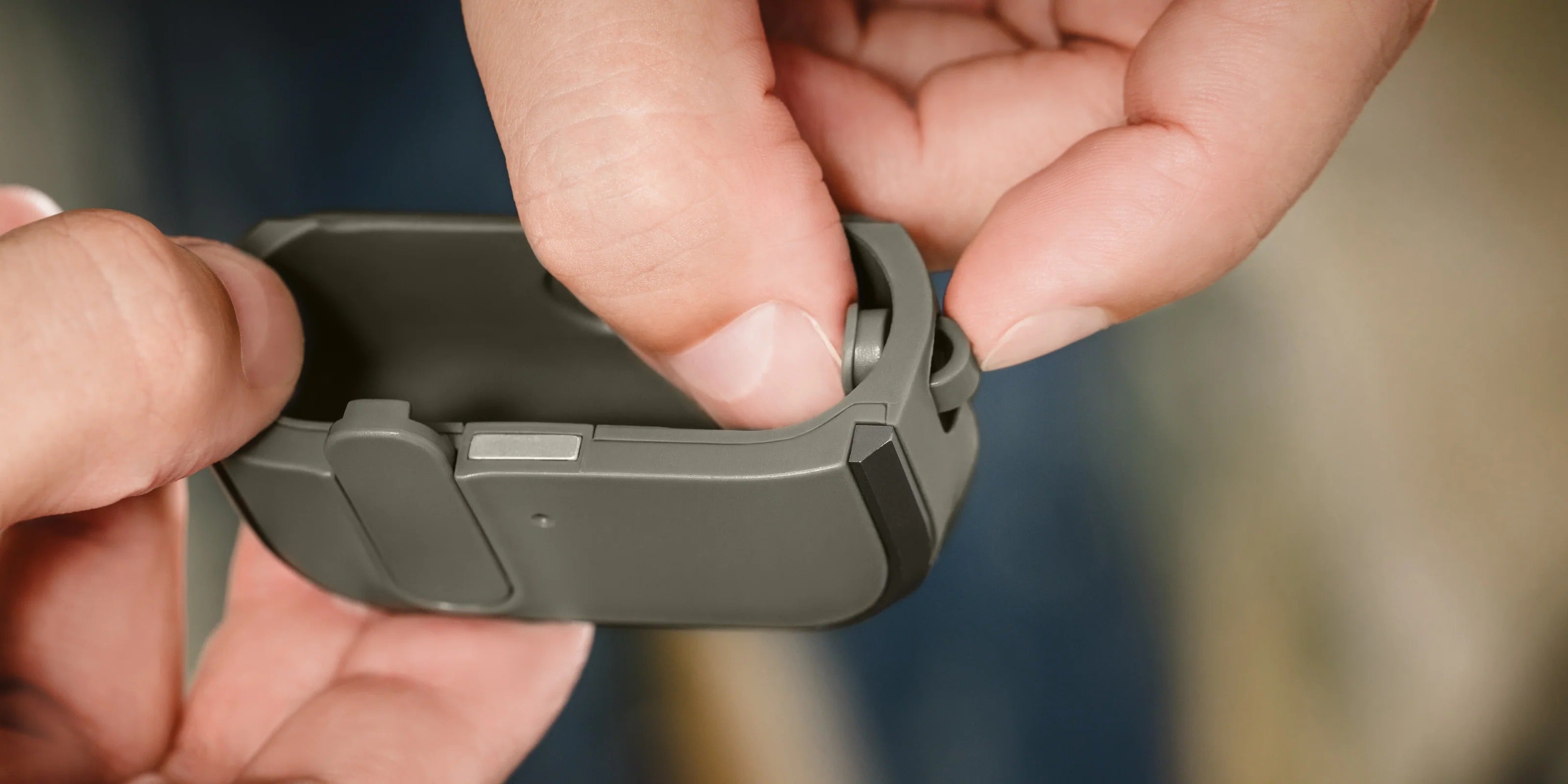 MAGEASY Odyssey AirPods 4 case in Metal Black, customizable buckle and carry setup feature graphic