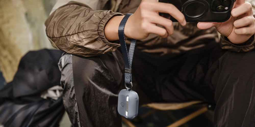 MAGEASY Odyssey AirPods 4 case in Metal Black, 15 mm wrist strap outdoor carry feature graphic
