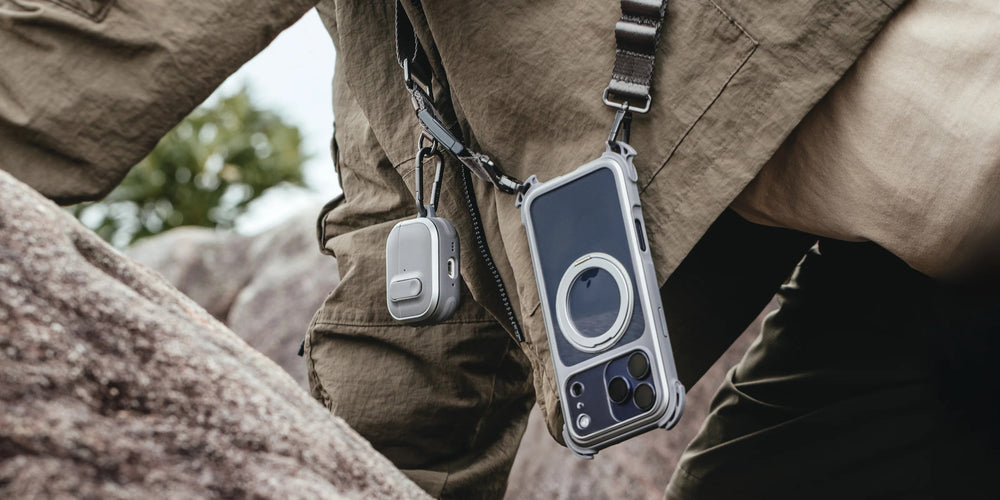 MAGEASY Odyssey rugged AirPods Pro 3 case clipped beside a phone pouch for outdoor carry