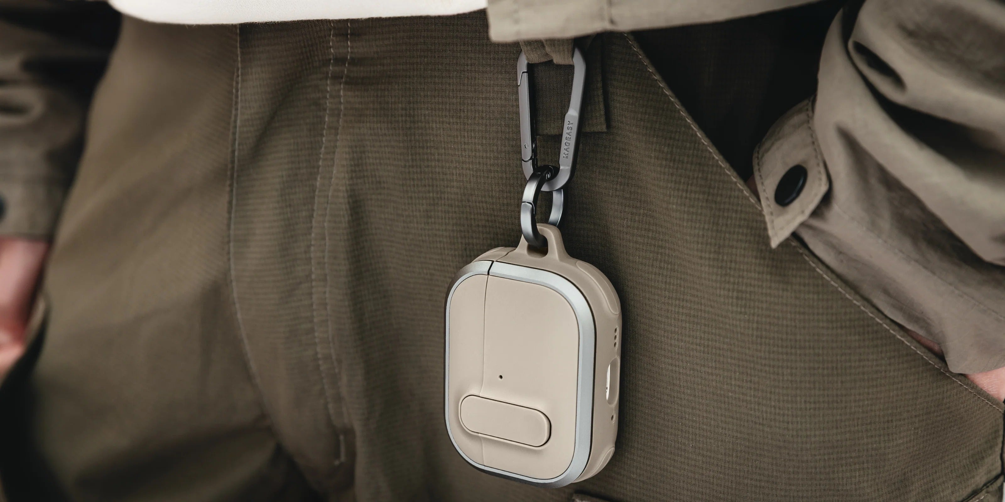 MAGEASY Odyssey outdoor AirPods Pro 3 case in hand with carabiner clip and strap detail