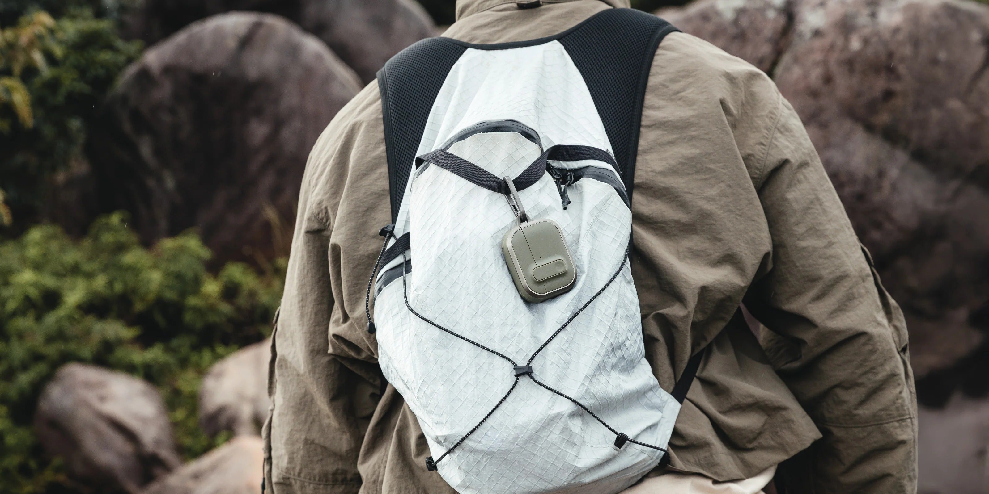 MAGEASY Odyssey rugged AirPods Pro 3 case attached to a backpack strap for easy access